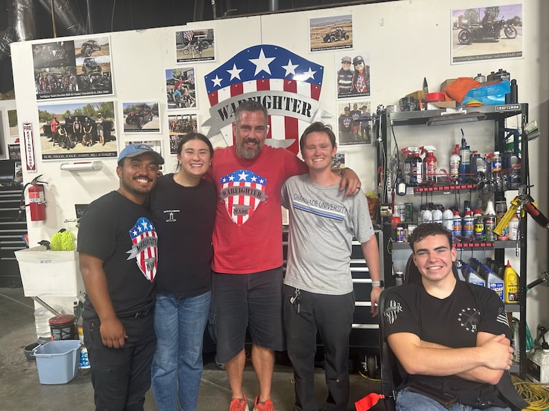 Elder Tryston O'Toole, second from the right, is pictured with co-workers at Warfighter Made in Temecula, California.