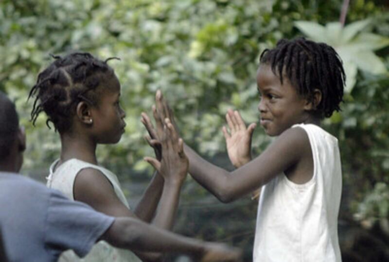 Haitians girls play in the streets in Port-au-Prince, Haiti, Thursday, Jan. 21, 2010.
