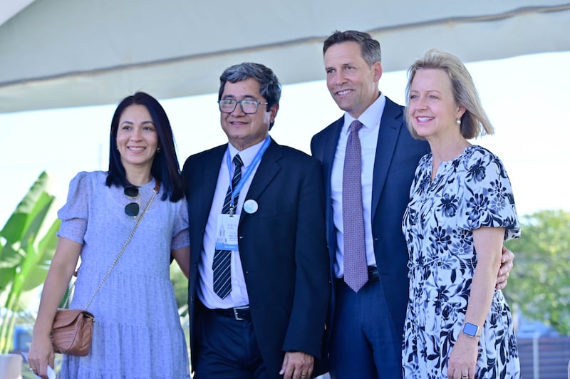 Elder B. Corey Cuvelier of the Brazil Area presidency and his wife, Sister Wendi Cuvelier, take a photo with guests at the groundbreaking ceremony for the Maceió Brazil Temple.