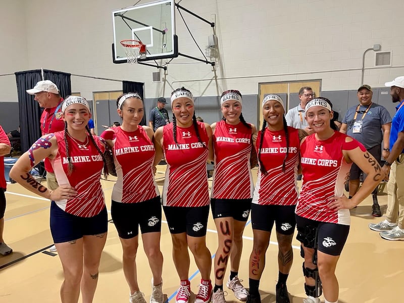 Retired U.S. Marine Maj. Yen Soto, third from the left, poses for a picture with rowing teammates before the rowing competition at the 2025 Warrior Games in Colorado Springs, Colorado.