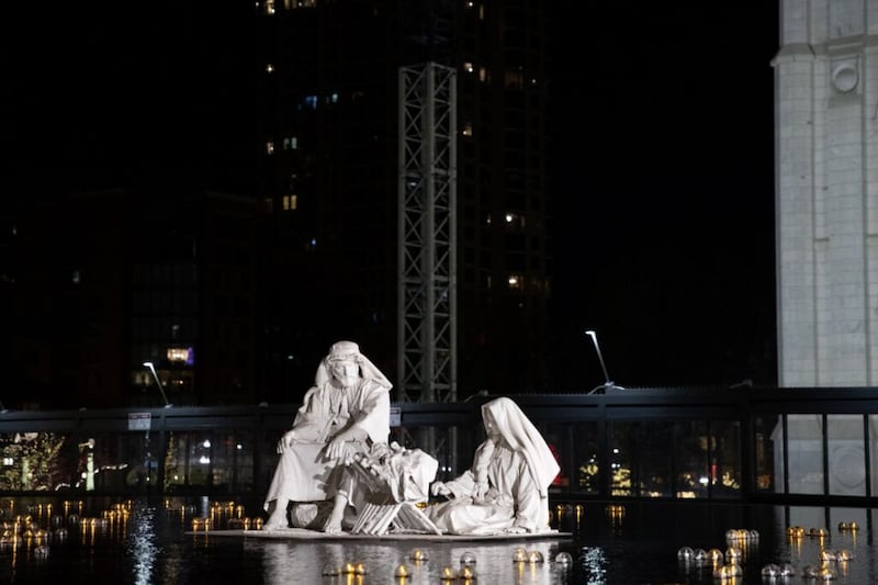 In the reflecting pool just east of the Salt Lake Temple, the baby Jesus; Mary, His mother; and Joseph appear to be floating on the water. Due to precautions associated with COVID-19, Temple Square visitors will be able to drive by or view the traditional Christmas light display from the sidewalk.