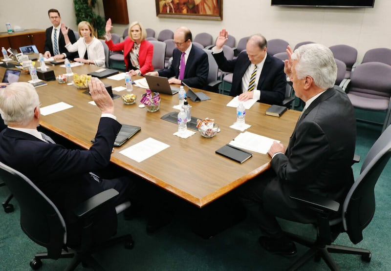 Five members of the Missionary Executive Council — clockwise from top, Sister Amy A. Wright, second counselor in the Primary general presidency; Young Women General President Bonnie H. Cordon; Elder Marcus B. Nash, a General Authority Seventy; and Elder Dieter F. Uchtdorf and Elder D. Todd Christofferson of the Quorum of the Twelve Apostles — raise their hands in a support of an item during a Missionary Executive Council meeting at the Church Office Building in Salt Lake City on Wednesday, May …