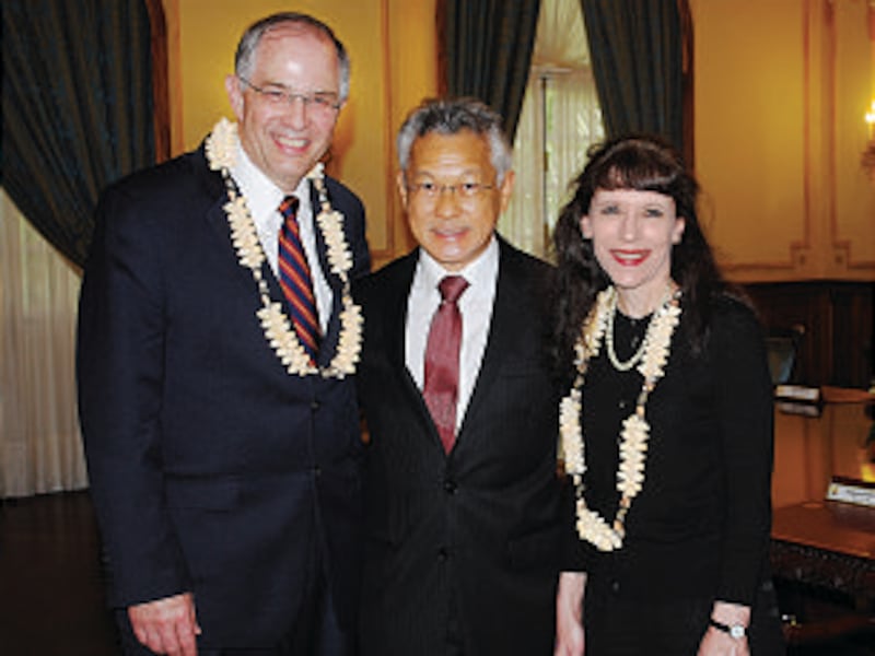 During his visit to Tahiti, Elder Neil L. Andersen and his wife, Kathy, stand with the president of