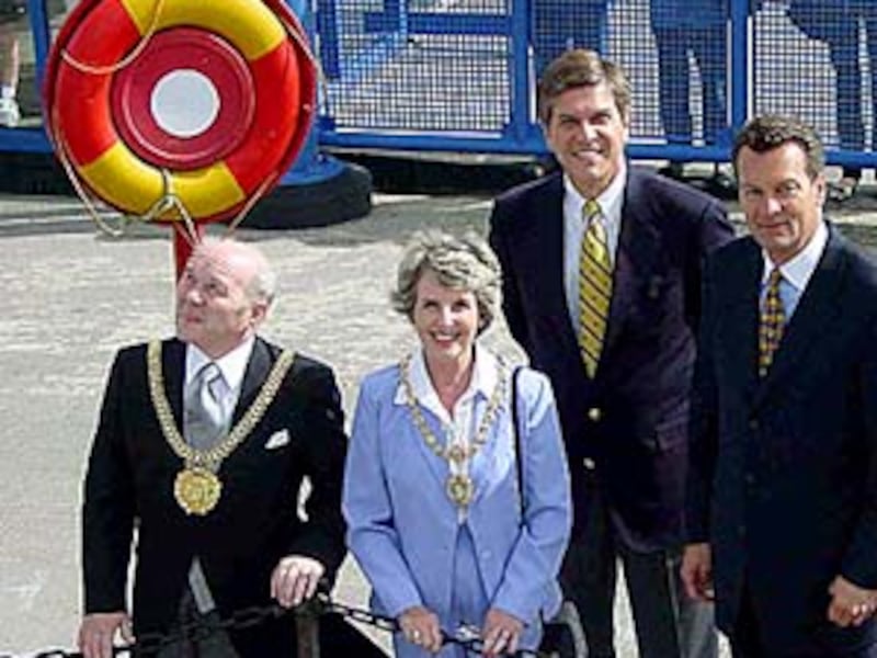 Waiting dockside to greet the ship's company is the Lord Mayor of Liverpool, Gerry Scott, and his wi