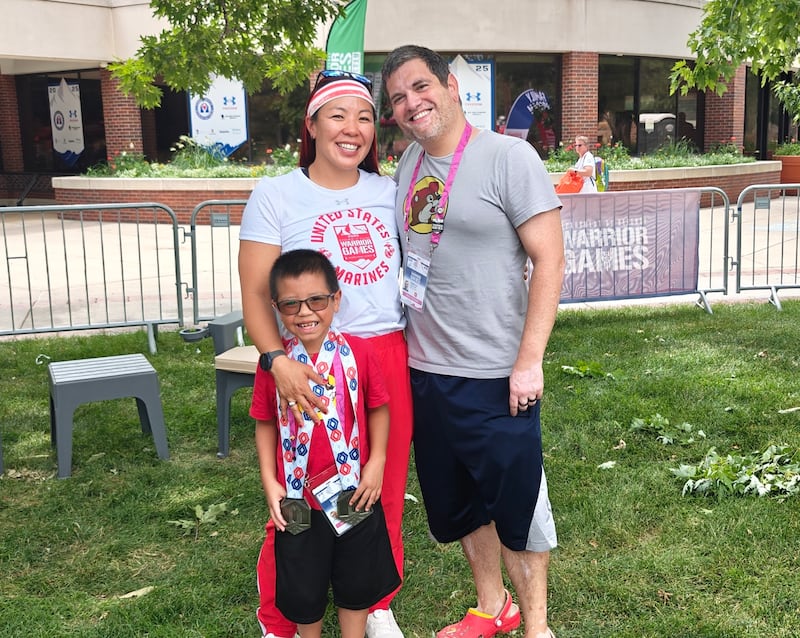 Retired U.S. Marine Maj. Yen Soto poses for a photo with her husband, Andrew Soto, and son, Kenji Soto, at the 2025 Warrior Games in Colorado Springs, Colorado.