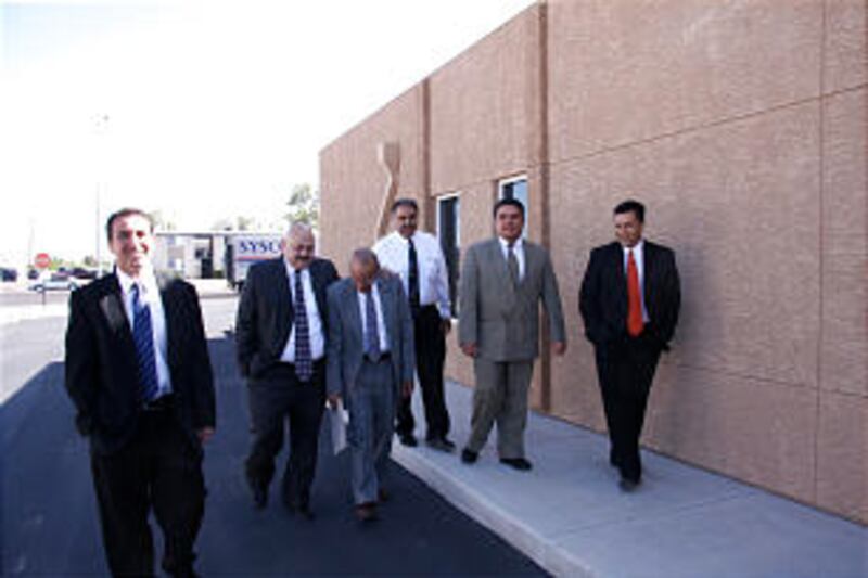 Branch president and patriarch from Spanish-speaking units in Tucson, Ariz., visit outside Church me