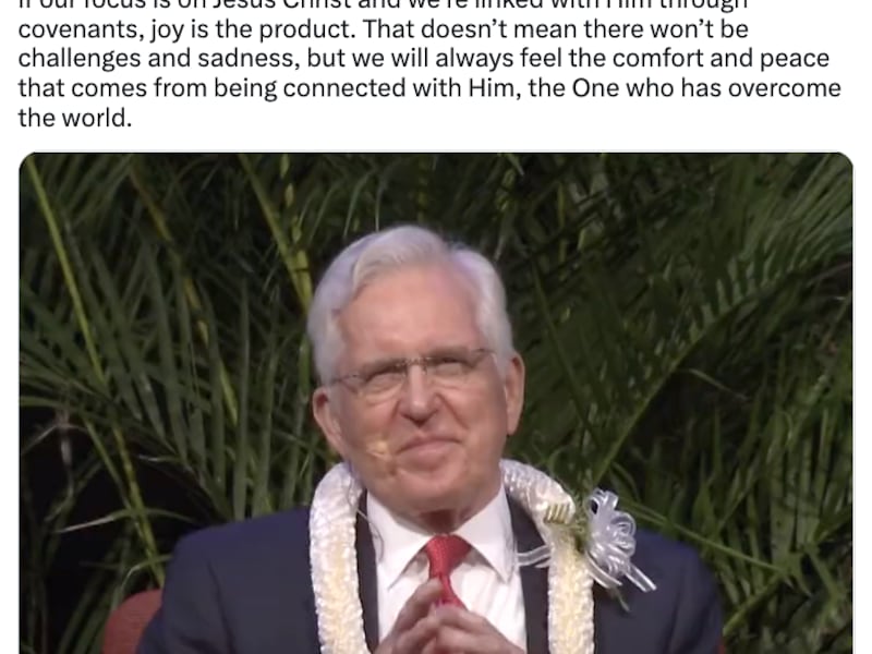 Screenshot of Elder Christofferson’s Twitter post. It includes a photo of him sitting with lei and a suit on and similing.