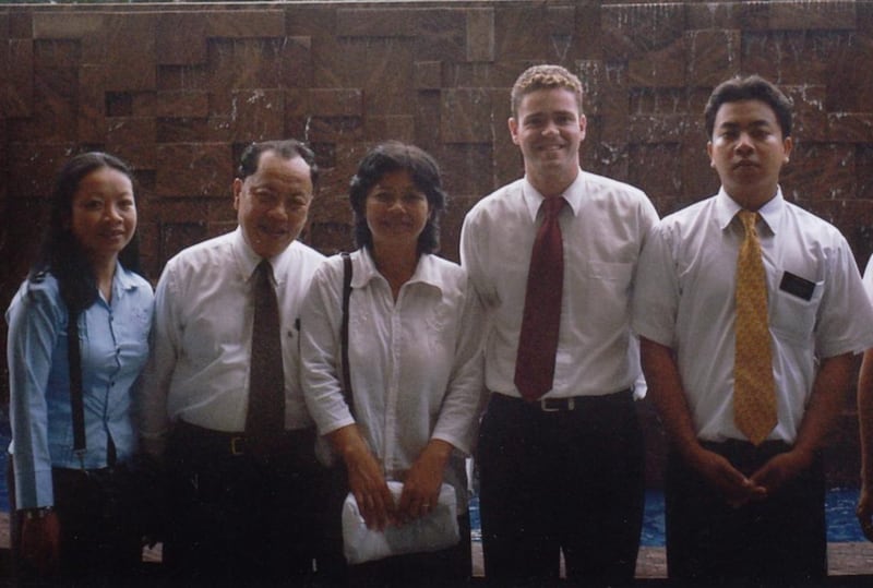 Former missionary David B.J. Hoare, second from right, meets up with Sam Sophon and Chan Sovan in Hong Kong for the family's temple sealing in August 2024.