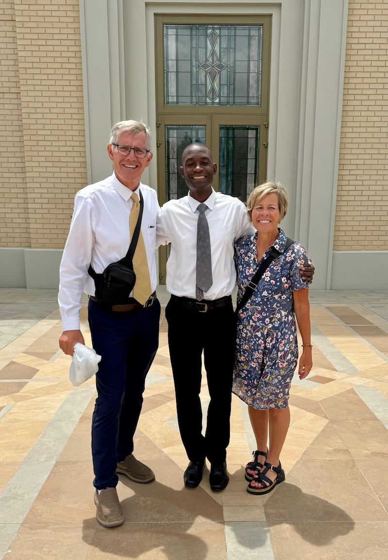 Kilford Shereni is photographed with Bruce and Elizabeth Anderson outside the Harare Zimbabwe Temple.