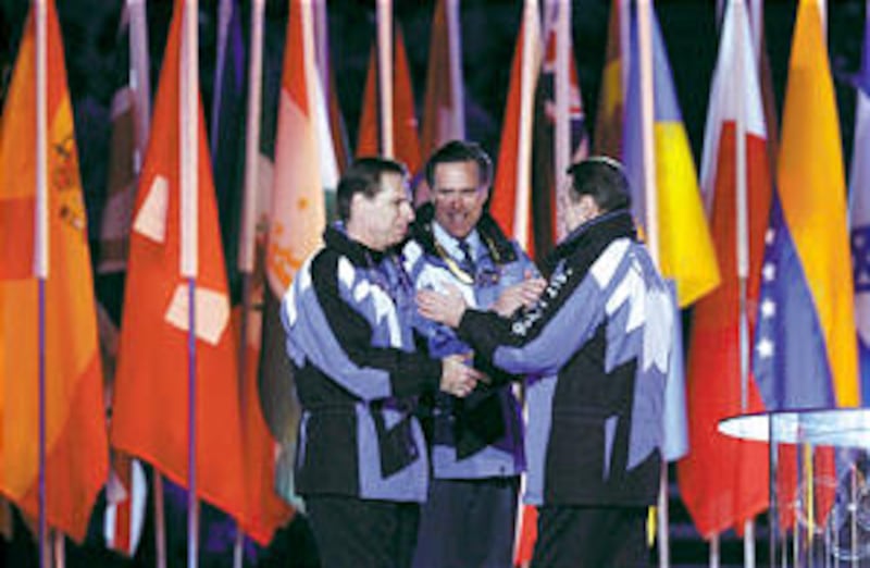 SLOC chief operating officer Fraser Bullock and SLOC president Mitt Romney, who are both Church memb