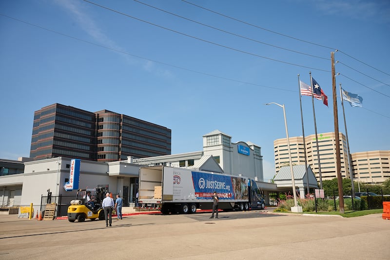 Volunteers help unload boxes of food from delivered from The Church of Jesus Christ of Latter-day Saints to Joe's Food Pantry in Dallas, Texas, on Thursday, May 14, 2026.