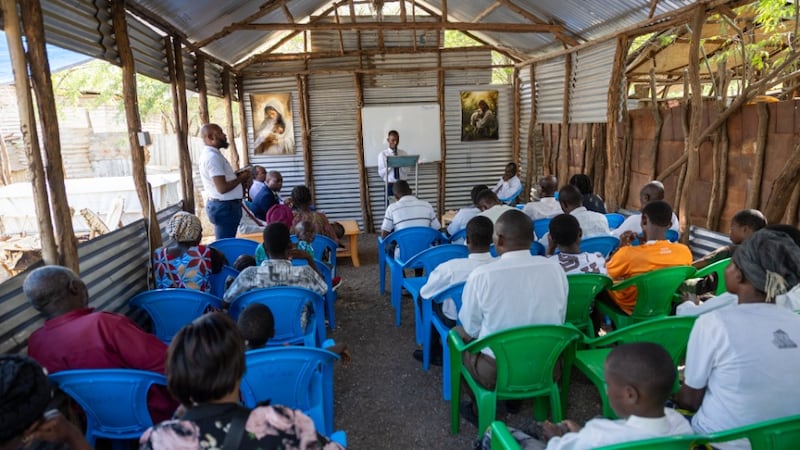 Members of the Kakuma chapter gather in a hut at Kakuma refugee camp in Kenya on June 19, 2026.