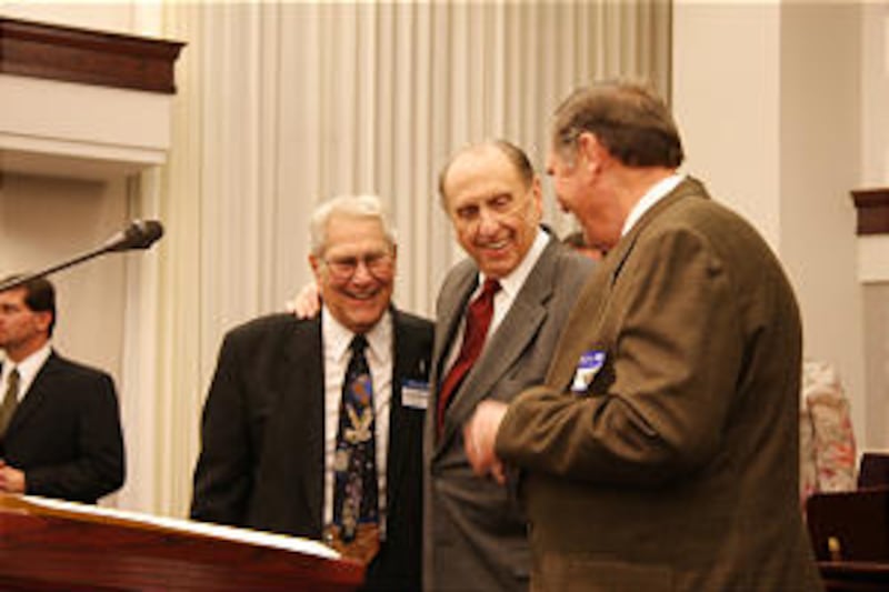 President Thomas S. Monson is greeted by Jack Hepworth, left, and brother, Robert Monson, at reunio