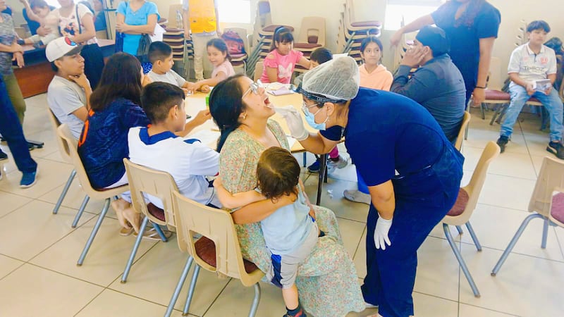 Volunteers conduct free dental checks in Lima, Peru, on Saturday, Aug. 8, 2026.