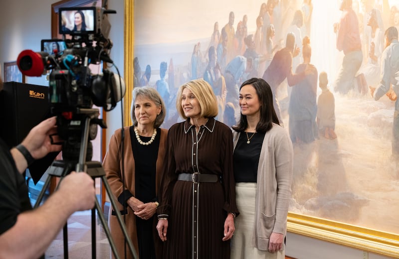 The Relief Society general presidency films a portion of the 2026 Relief Society worldwide devotional in front of a large painting in the Conference Center in Salt Lake City.