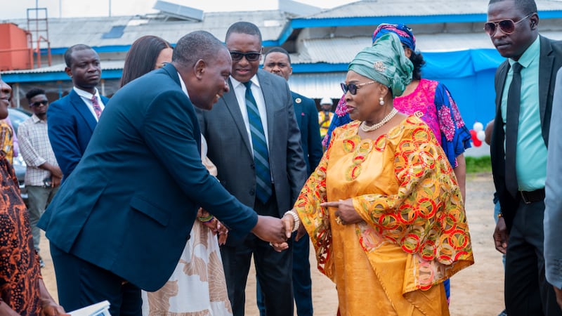 Liberia's first lady shakes hands with others at a hospital groundbreaking during the Strengthening Families Conference held June 19-20, 2026, in Monrovia, Liberia.