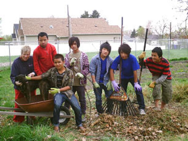 A group of Boy Scouts from Troop 1262 in South Salt Lake, Utah, participate in a neighborhood servi