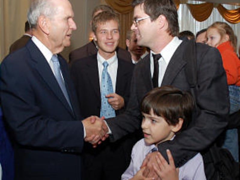 Elder Russell M. Nelson greets the Koltsovy family in Samara, Russia, on Oct. 23-25, 2009.
