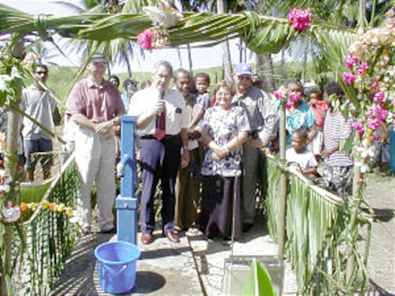 Elder Punga Paewai and Lady Caol Kidu, Papua New Guinea Government Minister, participate in dedicati