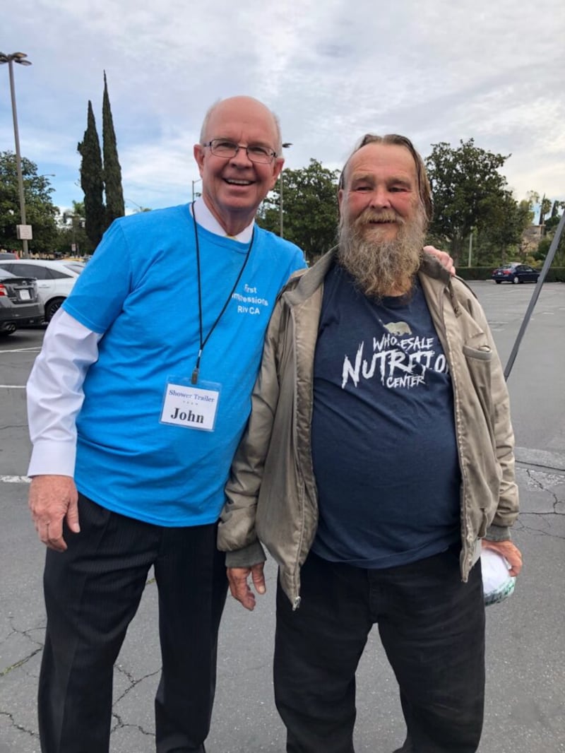 “Latter-day Saint Showers” co-organizer John Plocher, left, with a friend at a service project event in Riverside, California, prior to the 2020 pandemic.