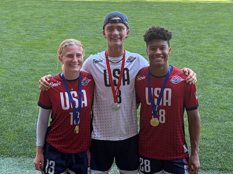 Emilee Jensen, Blake Holt and Silas Bell take a picture together after winning medals with Team USA at the World Junior Ultimate Championships in Logroño, Spain, on July 18, 2026.