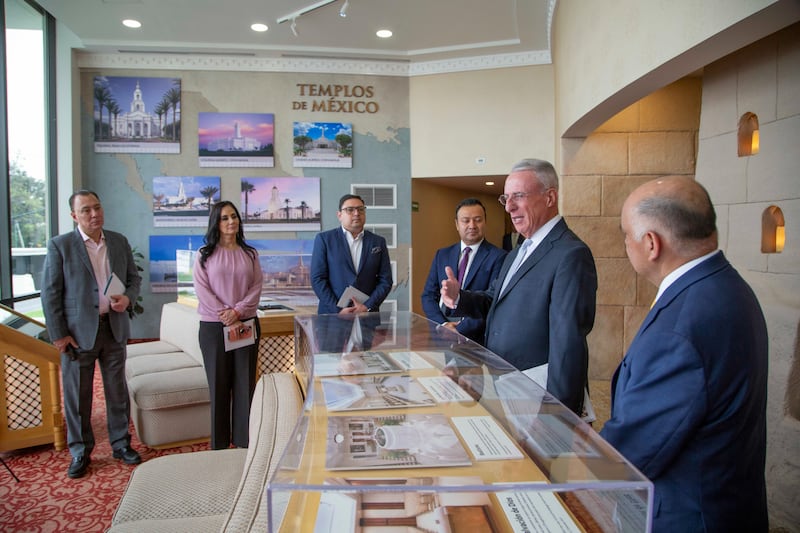 Elder Ulisses Soares of the Quorum of the Twelve Apostles, second from right, talks with news media at the Mexico City Mexico Temple Visitors’ Center in Mexico City, Mexico, on Aug. 27, 2026.