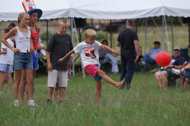 Members of the Abinadi and Hannah Seely Olsen family play kickball at a family reunion on Saturday, July 4, 2026, in Joe's Valley, Utah.