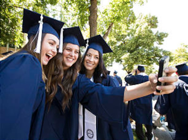 BYU Graduates take photos before the Summer Commencement exercises.