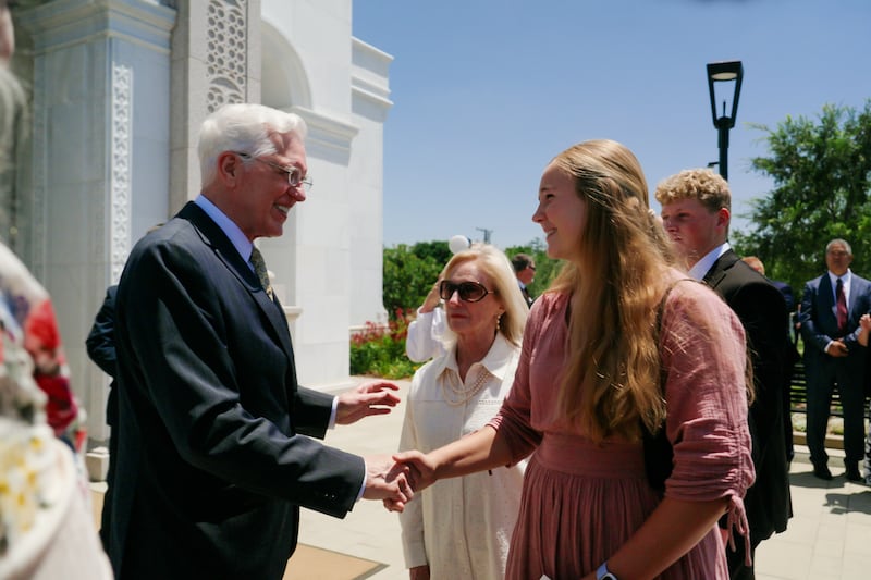 16-year-old Crissa Winger speaks with President D. Todd Christofferson, second counselor in the First Presidency of The Church of Jesus Christ of Latter-day Saints outside the Yorba Linda California Temple in Yorba Linda, California, and Sunday, June 7, 2026.