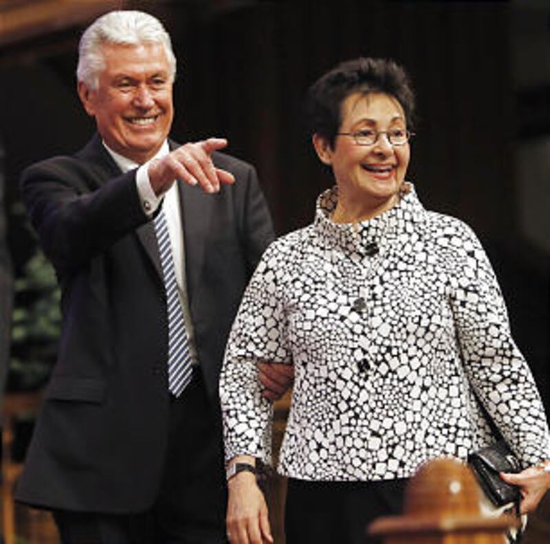 President Dieter F. Uchtdorf and Sister Harriet Uchtdorf walk onto the stand prior to speaking Sunda