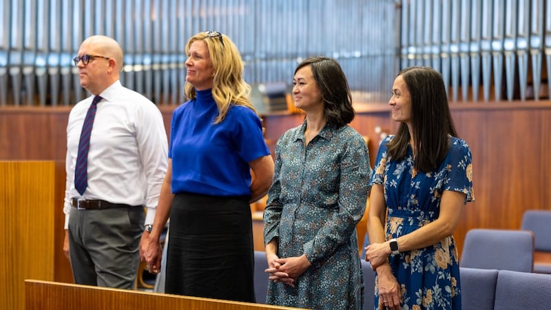 Sister Kristin M. Yee, her sister, Dawn Peterson, Elder James W. McConkie III and Sister Laurel McConkie stand during a meeting in Vienna, Austria, Sept. 1, 2026.