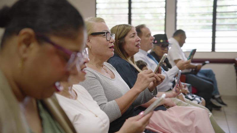 Members of a congregation in Puerto Rico sing selections from “Hymns for Home and Church” during sacrament meeting.
