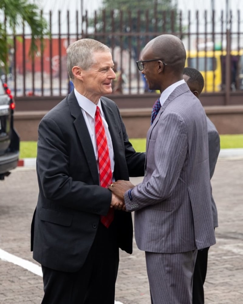 Elder David A. Bednar is welcomed by Kimbanseke Stake President Fabrice Kulenduka Mayele in Kinshasa, Democratic Republic of the Congo, Sunday, March 15, 2026.