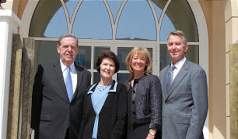 Elder Jeffrey R. Holland and his wife, Patricia, stand with Elder Larry S. Kacher and his wife, Paul