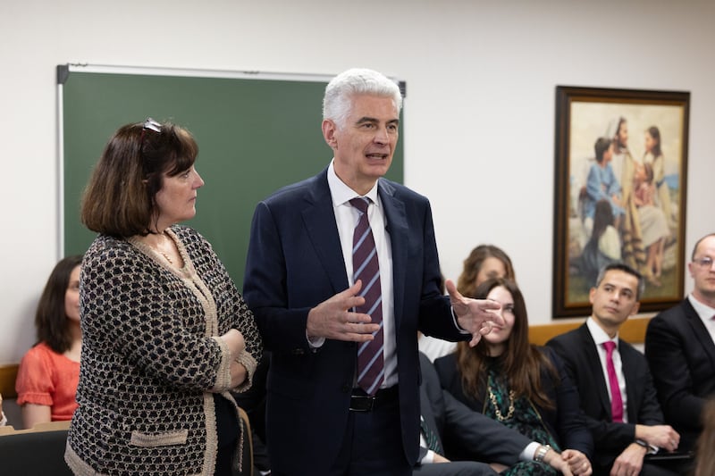 Elder Gérald Caussé of the Quorum of the Twelve Apostles and his wife, Valérie, speak to a gathering of pioneer Latter-day Saints from the east side of Paris, France, on Saturday, Feb. 21, 2026.