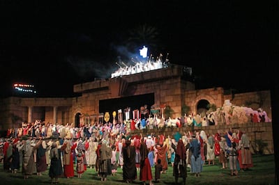 Cast members fill the stage and the grassy area in front while singing “I know He lives!” during the finale of the Mesa Easter Pageant.