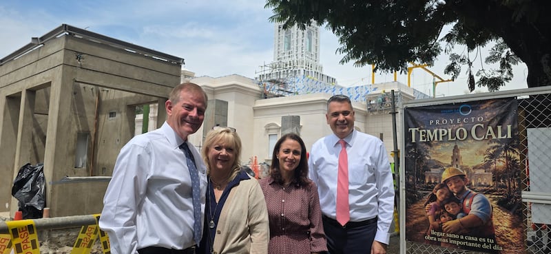 Elder Gary E. Stevenson of the Quorum of the Twelve Apostles and his wife, Sister Lesa Stevenson, left, join Elder Juan Pablo Villar, a General Authority Seventy, and his wife, Sister Carola Villar, outside the under-construction Cali Colombia Temple on Monday, Aug. 24, 2026. Ground was broken for the temple in March 2025.