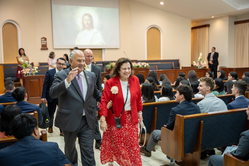 Elder Ronald A. Rasband of the Quorum of the Twelve Apostles and his wife, Sister Melanie Rasband, wave to the missionaries after a devotional in Managua, Nicaragua, on Friday, Oct. 16, 2026.