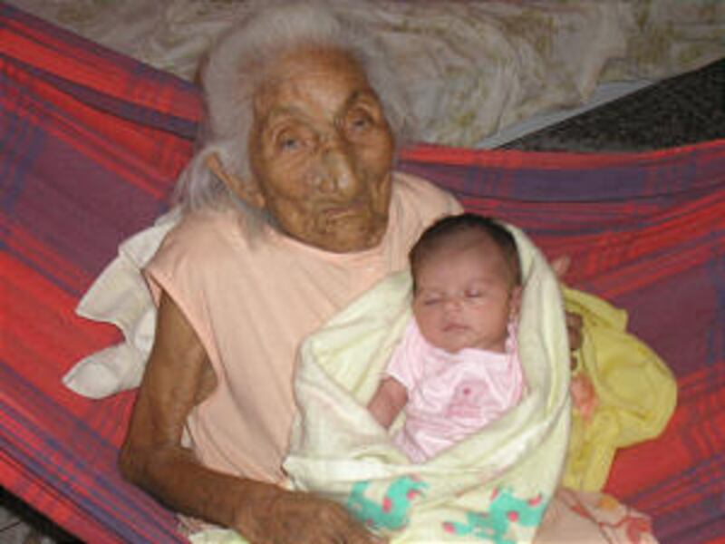Sister Amelia Costa dos Santos holds great-granddaughter Elis. Sister dos Santos has 15 children (fo