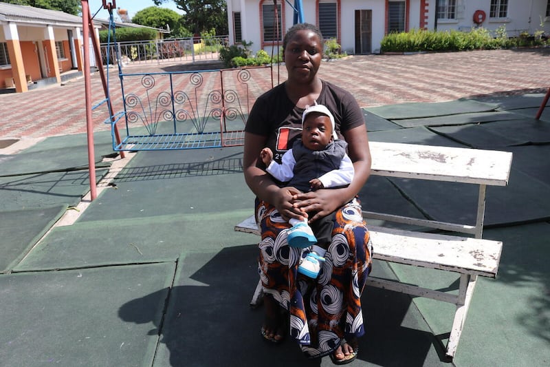 Samuel and his mother, Nasilele, whose last names were not given, sit outside the Lewanika General Hospital in Western Province, Zambia. Samuel was born premature in December 2024.
