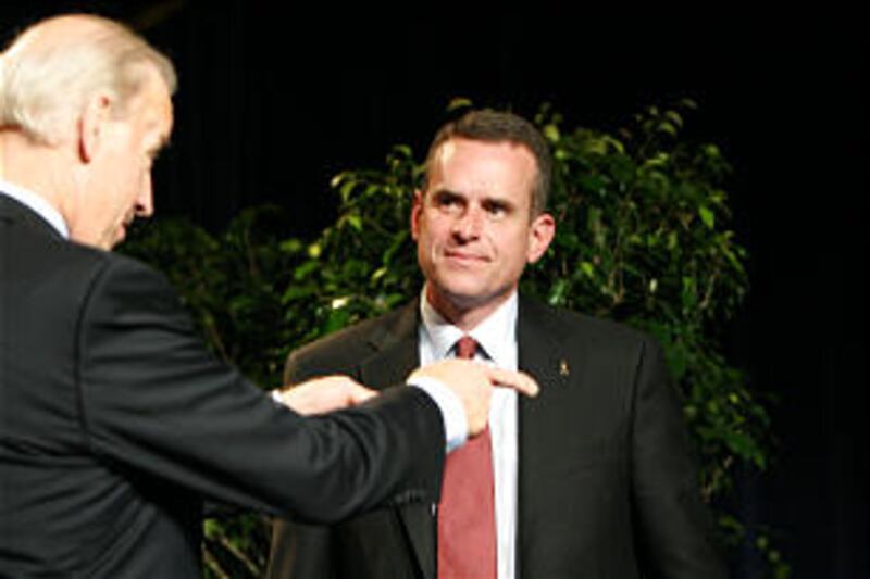 Vice President Joe Biden, left, talks to Rulon Stacey after presenting him with the 2008 Malcolm Bal