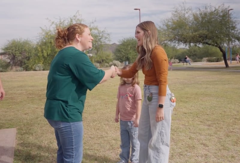 A member of the Apache Park Ward of the Glendale Arizona North Stake greets a woman and her daughter at a ward Easter breakfast.