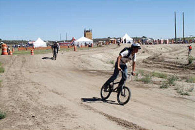 Scouts enjoy the BMX track at the 2013 Rise Up Scout Camp.