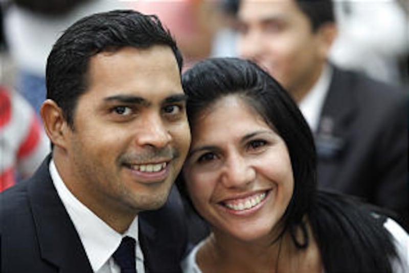 Church members in Venezuela smile after attending a meeting with Elder Quentin L. Cook of the Quorum