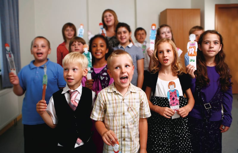 Primary children sing during singing time.