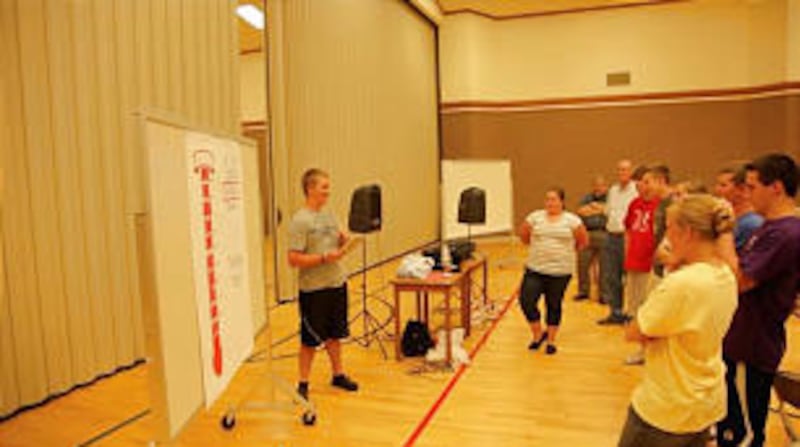Nathan Smith of the Chapel Valley 1st Ward, Lehi Utah South stake, talks to youth during an indexing