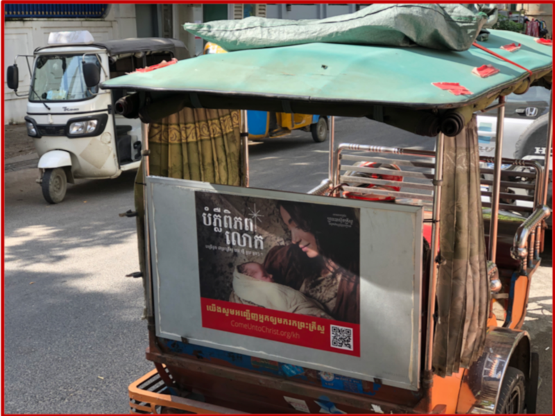 A #LightTheWorld ad is seen on the back of a tuk-tuk in Cambodia in December 2020.