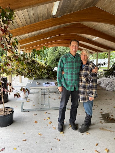 Fairfield Connecticut Stake President Todd Herget and his wife Nancy Herget organize trees at the Trumbull Ward pavilion