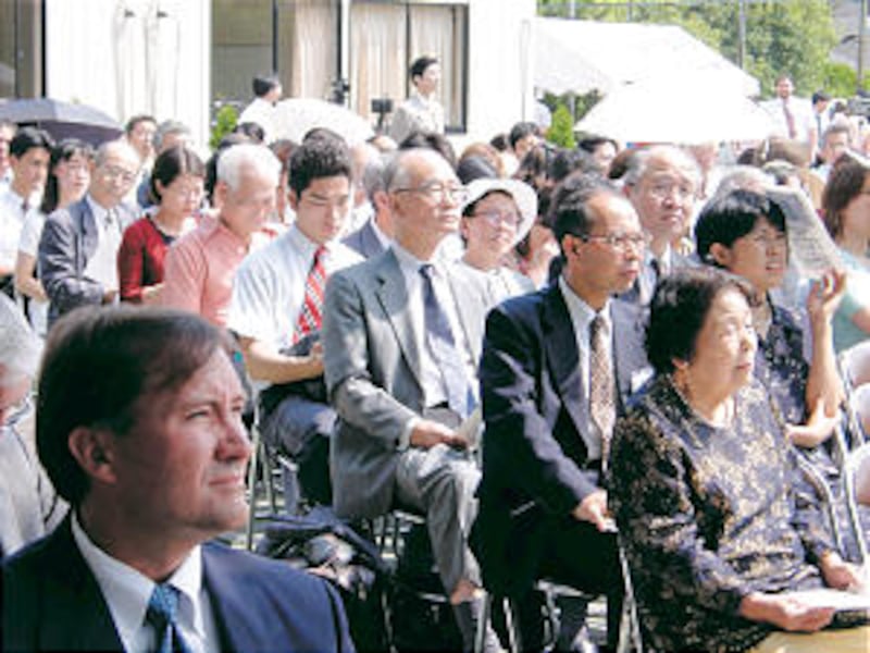 A few of Japan's 110,000 Church members listen to proceedings of the celebration of the centennial o