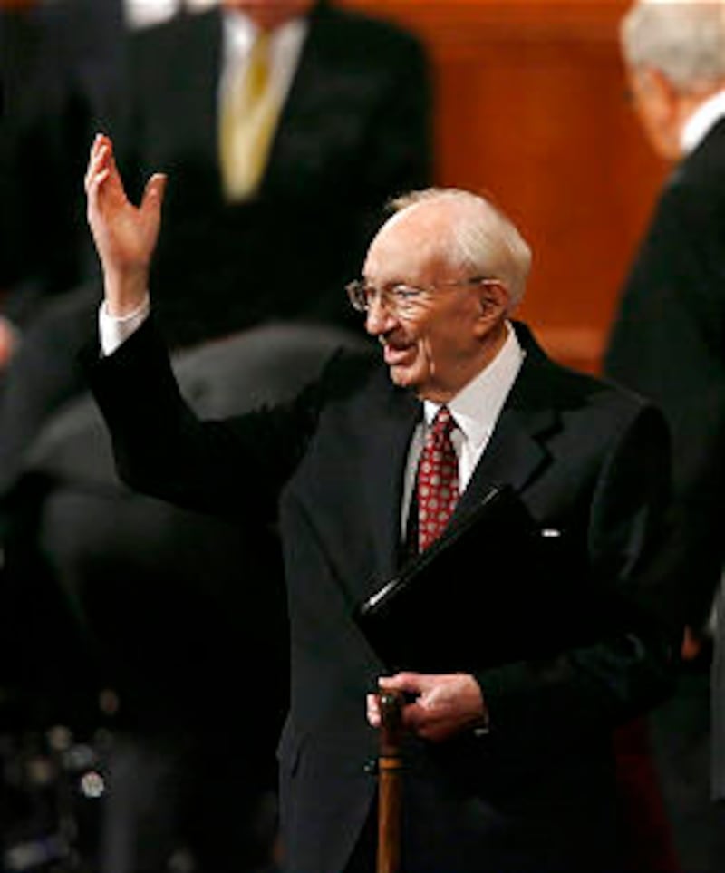 President Gordon B. Hinckley waves to the crowd after the Sunday afternoon session of general confer